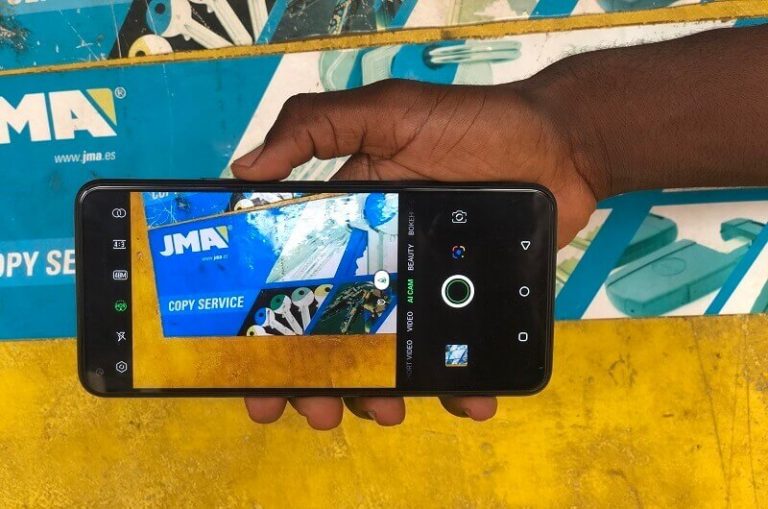holding phone and taking a picture